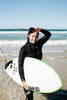 Women Surfer In New Zealand Waves. Wearing a Coastlines Thermal Wetsuit.