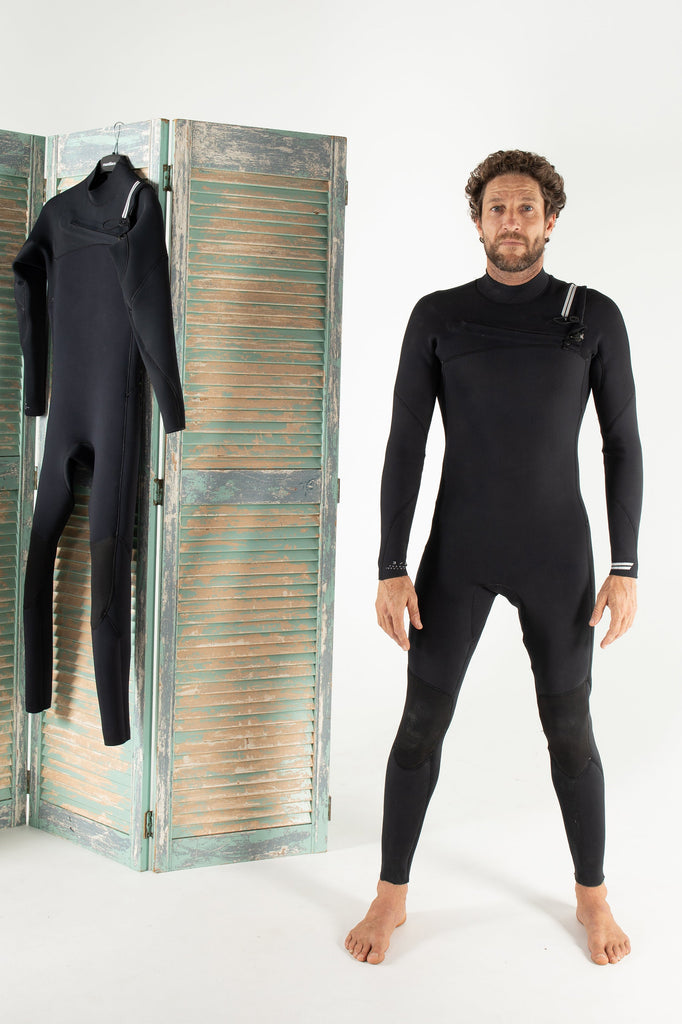 Beau Young Wearing thermal insulated merino lined Coastlines Wetsuit